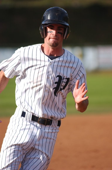 Palisades High shortstop Andy Megee rounds the bases after hitting a home run in the Dolphins' 12-6 victory over Malibu Saturday at George Robert Field. Megee had four hits and five RBIs.